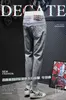 Mäns jeansdesigner High End tryckt cigarettgrå beskurna jeans herremärke varumärke mångsidig avancerad elastisk avsmalnande smala leggings 9 y7pu