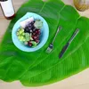 Dekorativa blommor Gröna tropiska konstgjorda bananblad Placemats bordsdekoration värmebeständiga dryck koppar distriktar faux pad matsal