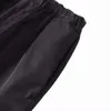 Version correcte de la marque Trendy P Family Autumn et hiver nouveau triangle inversé épissant un pantalon en nylon lâche et polyvalent pour les hommes et les femmes