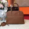 حقيبة مصممة من الجلد عالية الوضوح ترتيب عائلة من الجلد الأصلي bolide27/31cm قذيفة حقيبة Togo Top Leater Leather Leather Portable Bag