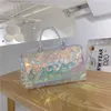 bolsa de grife 2023 verão nova bolsa feminina colorida transparente viagens de lazer fitness bagage laser de mão fria e fria