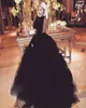 Attractive Open Backless Prom Dress Jewel Neck Long Sleeves Fluffy Floor Length Ball Gown Evening Dress Sexy Black Puffy Tulle Eve3376791