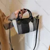 Baobao Womens 2024 Nieuwe Koreaanse handheld Dumpling Bun trendy en populaire hoogwaardige stofstreep enkele schouder crossbody tas