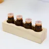 Lagringslådor Essential Oil Rack har 4 flaskor Nagellack Tablett Display Stand Trähållare Kosmetisk arrangör