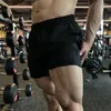 Esportes de shorts de shorts masculinos para homens e mulheres treinamentos elásticos, executando o fitness de três quartos do verão americano