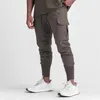 Pocket Mens Cargo Pants Summer Thin Slim snabbtorkande elastiska leggings som kör träning Sweatpants Casual trendbyxor 240402