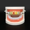 Selling Hot Hiphop Gold Teeth Top Grillz Hiphop Tooth Dental Grills Dental Halloween Vampire Cosply Gold Teeth Caps Golden en