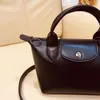 2024 Womens New Cute Exquisite Leather Dumpling Bag Designer Solid Mini Ladies Crossbody Bag Shopping Travel Shoulder Bag Clearance