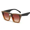 Lunettes de soleil Femmes Rhinestone Cat Eye Men Men de lunettes rétro Vintage UV400 2024