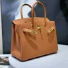 Sac en cuir haute définition sac de qualité du sac de qualité Tempérament pour femmes en cuir portable portable motif en lit haut de gamme haut de gamme togo vache en cuir pour femmes en cuir