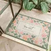 Tapis moderne moderne de fleurs minimalistes peut être coupée dans les tapis de porte du porche extérieur frottant le tapis sans glissement résistant au sol