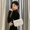 Designer Womens Handtasche Diesi Nischendesign neues Produkt Single Schulterkreuzkörper Achsel Jingle Tragbares Cowhide kleine quadratische Tasche für Frauen