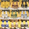 Luxuros Slipers Slides de designer de couro para homens Mulheres São de verão Praia Sandália Moda de salto baixo Sapatos de chinelos planos Sandálias planas clássicas Tamanho 35-42