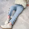 Broekmeisjes jeans lente en herfst nieuwe Koreaanse versie babymeisje casual broek knop elastische mode kinderen kinderen flard pants l46