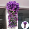 Fiori decorativi fiore artificiale vite appesa elegante ghirlanda viola viola per un matrimonio all'aperto interno