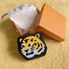 Key Rings Designer L Family's New Cartoon Tiger Wallet Zipper Clip Sac Sac Pendant 2022 Année de la carte Tiger CSHT