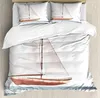 Sängkläder sätter nautiska uppsättningar för sovrummet säng hemsjön föremål på träbakgrund med vintage boa täcke täckt täcke och örngott