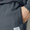 Parcours masculins 2pcs / ensembles hommes Casual Sport Costume Texture Waffle O-cou à manches longues Sweatshirt Elastic Pockets Pantalons de jogger enlacés