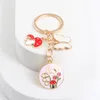 Keychains mignons de papillons en émail en émail porte-clés belles chaînes clés de plaque ronde