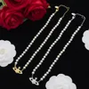 Neu gestaltete Perlen Halskette Blau Emaille Farbe Saturn Plendant Frauen Kristallkrusted Orb Safety Pin Motiv Hochzeit Schmuck Sets Designer Schmuck N0246