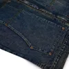 Gewassen denim werkkledingjack met trendy ontwerp voor high -straten voor mannen en vrouwen.Pocketcollectie met revers met rits en vliegende jas