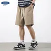 Herrbyxor skyddar en lapptäcke khaki casual shorts