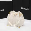 Sac en cuir Femmes 2024 Nouveau mini seau en cuir tiktok diamant petite chaîne de perles de parfum