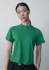 2023女性の春と秋のシンプルなファッション汎用性の高いソリッドカラーカールした半袖ラウンドネックプルオーバールーズ女性Tシャツ