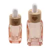 Botellas de almacenamiento Botella de vidrio Botella transparente Ojo rosa para líquidos Perfume