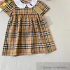 Preppy Style Girls Plaid Kleider Kids Doll Dorpe Short Sleeve Plissee Kleid 2024 Sommer Kinder Baumwollgitter Kleidung S1307