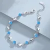 Versão coreana do cristal artístico do Ocean Heart com mulheres embutidas de diamante, pulseira em forma de coração de zircão azul para casais como um presente