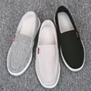 Lässige Schuhe Frühling Herren -Leinwand Pedal Slip auf massiven Herren -Sneakers atmungsaktiven Gummi -Männchen Flach