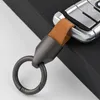 Keychains Lanyards Luxury Herren Schlüsselbund Mode Haltbares Lederauto Keyring -Halterung Hufeisen Schnalle Geschenkzubehör Großhandel Q240403