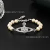 Versione alta Nuova classica Empress Dowager Bracciale Saturno Pearl con Trend di lusso di Luce Luce Diamond Female Live Streaming