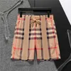 2024 Designer shorts masculinos de moda primavera Fashion Street Stripe Quick Swdeswear Awear exclusivo impressão xadrez casual nova praia calça grande tamanho asiático M-3xl