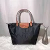 Lüks uzun şampiyon çantalar Tote moda tasarımcı çantaları chammp bayanlar yüksek kaliteli crossbody longchammp debriyaj totes siyah şampiyonlar katı renkli çantalar