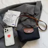 2024 2024 Ny trendig lyxdesigner Mini Nylon Shoulder Crossbody Väskor för kvinnliga kvinnliga handväskor och Purses Messenger Bag Sac A Mian 10a AZ