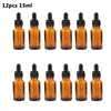 Botellas de almacenamiento 12 piezas/juegos 15 ml Pipeta de vidrio ámbar recargable de botella de gotero vacío para líquido de aceite esencial