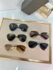 Designer de marca de alta qualidade masculino de óculos de sol Design de luxo feminino piloto de sol de sol elegante metal vintage ao ar livre dirigindo lentes de sol shades praia celebridade do óculos de sol