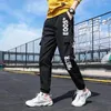 Calça masculina estilo americano estilo sanitária primavera e outono na moda casual de ajuste solto liso seca rápida secagem