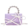 2024 perline di moda per bambini per bambini Portili PU PU PICCOLA PACCHIA SPOLLA SOLO CrossBoddy Girl's Fashion Borse Mini Borsa