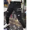 Jeans masculin Luxury 2023 Street Men Street Korean Black Black avec fermeture à glissière Trade de trou de trou de la ferme
