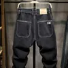 Męskie dżinsy czarne dżinsy męskie spodnie haremowe luźne spodnie kieszonkowe zwężające się uliczne odzież męska odzież dżins trojańska nowości przybysze w 2023L2403