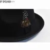 Brede rand hoeden emmer heren wollen blend fedoras hoed en veer Britse stijl trilby jazz panama feest bruiloft sombreros de mujer yq240407