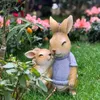 芸術と工芸品漫画の動物工芸装飾品シミュレーション動物彫刻ウサギはアーデン中庭の子どもの部屋の家の装飾を抱きますL2447