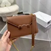 Designer väska tonåring triomph väska vintage väska crossbody väska tyg tryck väska sadel väska baguette tygväska baguett väska lyxhandväska kuvert resväskor