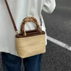 Casual strandtassen hoogwaardige kleine tas voor vrouwen in de zomer niche crossbody geweven dames draagbare stro -emmer