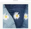 Beauts à bord large baquet INS COREAN DAISY BRODERIE CHAPEMENT FEMMES Men Panama Summer Sun Flower Bob Washed Denim Fisherman Q240403