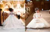 2020 Lovely Flower Girls Dresses For Weddings Princess Jewel Long Sleeves Lace Appliques Big Bow Sweep Train Little Kids Holy Page1381066