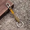 Keychains Lanyards MKENDN Double Chain Keychain Mens Handmade Weaving Outdoor Climbing Umbrella Rope Snake Knot Emergency Metal Keyring Q240403